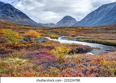 Colorful autumn tundra in front of the Malaya Belaya river bend in Hibiny mountains above the Arctic Circle, Russia