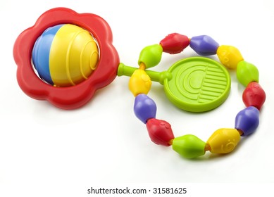 A Colorful Baby Rattle And Teething Ring, Isolated On White Background With Copy Space