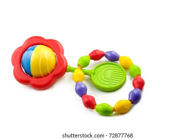 A Colorful Baby Rattle And Teething Ring Isolated On A White Horizontal Background With Copy Space