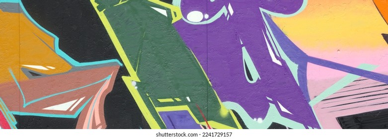 Colorful background of graffiti painting artwork with bright aerosol strips on metal wall. Old school street art piece made with aerosol spray paint cans. Contemporary youth culture backdrop - Shutterstock ID 2241729157
