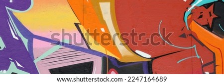 Colorful background of graffiti painting artwork with bright aerosol strips on metal wall. Old school street art piece made with aerosol spray paint cans. Contemporary youth culture backdrop