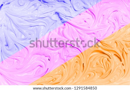 A colorful background with an interesting texture. Plastic mass with pudding structure. Abstract background with three colors.