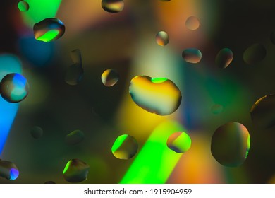 Colorful background made of drops on a glass plate