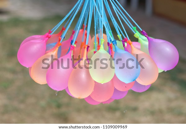 Colorful balloons filled with\
water