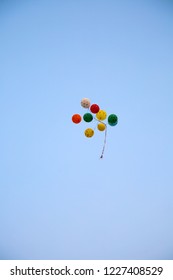 Colorful Balloons Float Away In The Air. Blue Sky With Balloons