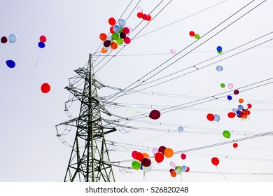 Colorful balloons Flying trough Electrical power lines - Powered by Shutterstock
