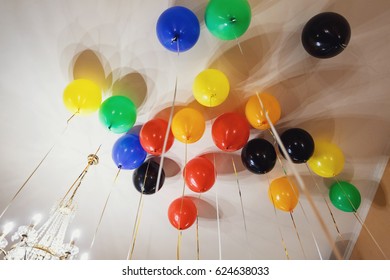 Colorful balloons hang under the ceiling - Powered by Shutterstock