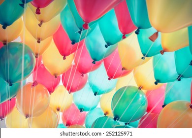 colorful balloons with happy celebration party background - Shutterstock ID 252125971