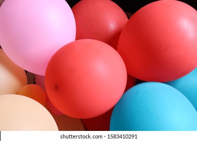 Colorful balloons on black backgound - Shutterstock ID 1583410291