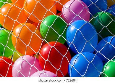 colorful balloons under net