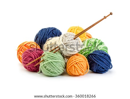 Colorful balls of yarn and wooden needles isolated on white background