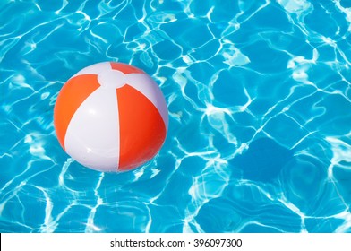 Colorful Beach Ball Floating In A Pool