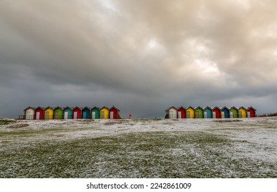 The colorful beach huts at Blyth beach surrounded by snow in a wintery Northumberland, England - Powered by Shutterstock