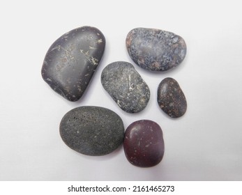 Colorful Beach And River Stones Isolated On A White Background. Study Content For Students Of Geology And Geosciences.