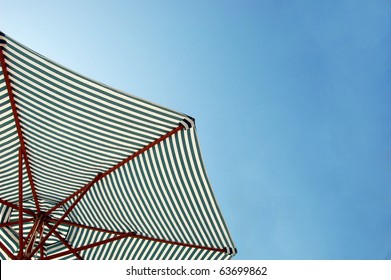 Colorful Beach Umbrella Against The Sun Light