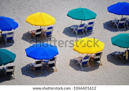 Colorful beach umbrellas from above.