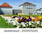 Colorful and beautiful flowers blooming in front of Nymphenburg Castle