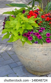 Colorful Begonia And Petunia Flower Planter On Patio