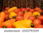 Colorful bell peppers and ripe tomatoes are being washed, surrounded by bubbles and splashes of water, showcasing fresh produce ready for cooking.