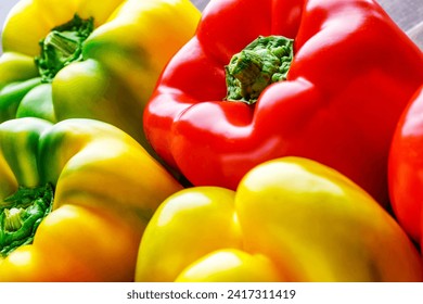 Colorful bell peppers.Close up of assorted red and yellow bell peppers(bell pepper,capcicum). Also known as Sweet pepper, Pepper or Capsicum.top view - Powered by Shutterstock