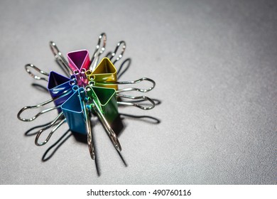 colorful binder clips on isolated background