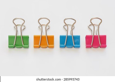 Colorful binder clips on white background - Powered by Shutterstock