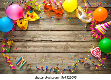 Colorful Birthday Or Carnival Frame With Party Items On Wooden Background