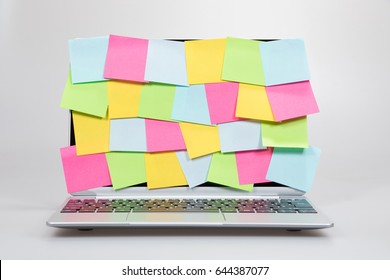 Colorful Blank Sticky Memos Completely Covering An Open Laptop Screen Viewed Low Angle Straight On In A Conceptual Image