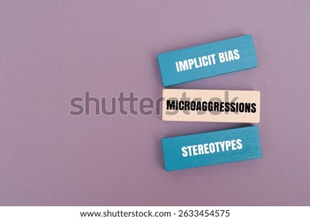 Colorful block with text IMPLICIT BIAS, MICROAGGRESSIONS, STEREOTYPES
