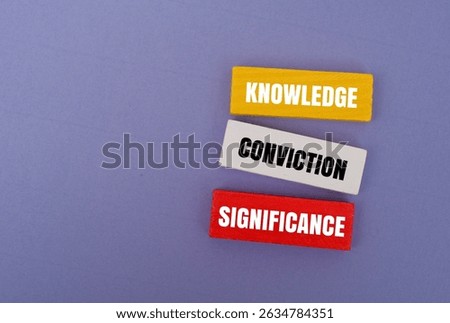 Colorful block with text KNOWLEDGE, CONVICTION, SIGNIFICANCE