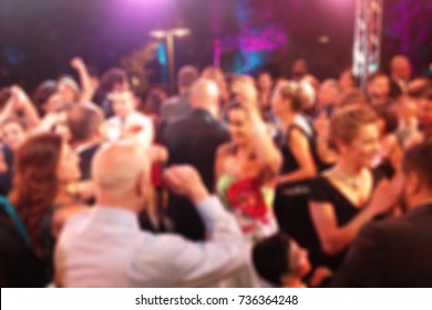 Colorful Blurred background of night dancing party  in a restaurant outdoor