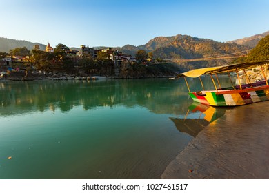 Colorful Boat In Green And Clean Ganges River At Sunset In Rishikesh, Uttarakhand, India