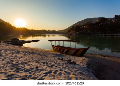 Colorful Boat In Green And Clean Ganges River At Sunset In Rishikesh, Uttarakhand, India