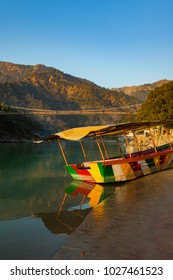 Colorful Boat In Green And Clean Ganges River At Sunset In Rishikesh, Uttarakhand, India