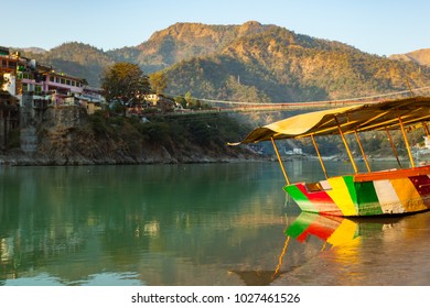 Colorful Boat In Green And Clean Ganges River At Sunset In Rishikesh, Uttarakhand, India