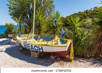 Colorful boat with the inscription Xigia Beach on Zakynthos island. Greece.