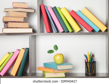 Colorful Book, Apple And Pencils On The Bookshelf