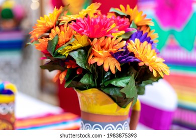 A Colorful Bouquet Of Flowers In A Painted Vase; Fiesta Celebration Decor