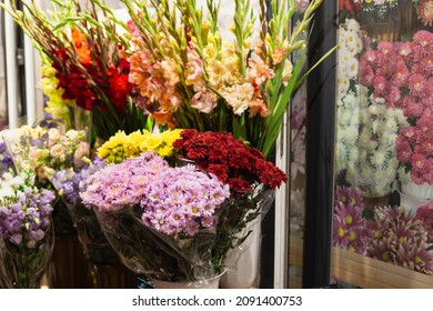 Colorful Bouquets In Vases. Florist Shop Exterior With Copy Space.