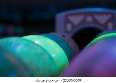 Colorful Bowling Balls On Stand. Ball Return At Bowling Club. Background Of Bowling Balls Close Up