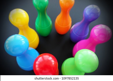 Colorful Bowling Pins Or Skittles On Dark Background, Top View

