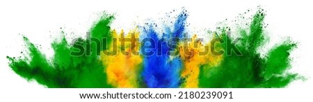 colorful brazilian flag green yellow blue color holi paint powder explosion on isolated white background. brazil rio de janeiro carnival qatar and celebration soccer fans travel tourism concept