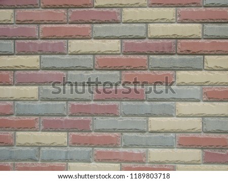 Colorful brick wall pattern, painted bricks as urban design texture.
