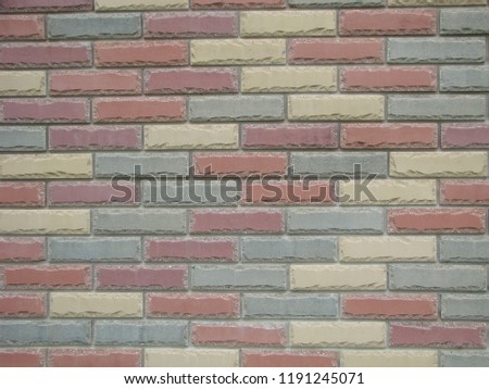 Colorful brick wall pattern, painted bricks as urban design texture.