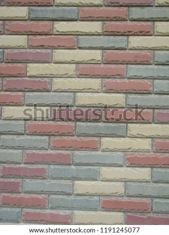 Colorful brick wall pattern, painted bricks as urban design texture.