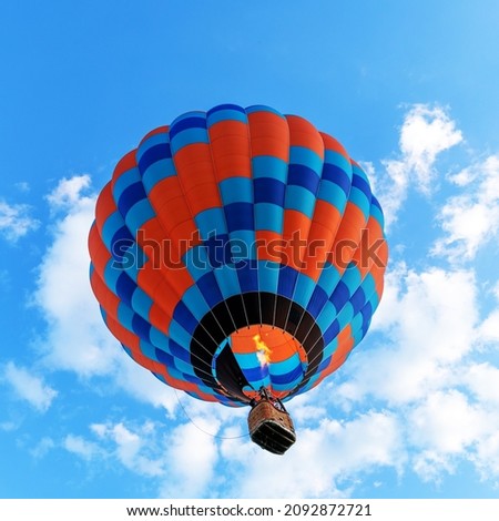 colorful bright balloon on a background of blue sky bottom view.