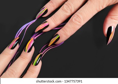 Colorful bright manicure and different sharp shape nails framed and black lacquer Nail art  Creative nail design black background 