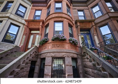 colorful brownstone buildings in an iconic neighborhood of Brooklyn, New York City.