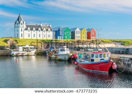 The colorful buildings of John O'Groats in a sunny afternoon, Caithness county, Scotland.