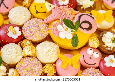 Colorful Cake Donuts With Colorful Frosting For A Child's 6th Birthday Party.